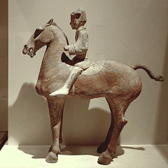 A Western-Han painted ceramic mounted cavalryman from the tomb of a military general 
