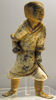 An Eastern-Han pottery soldier, with a now-faded coating of paint, is missing a weapon.